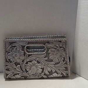 Metallic gray stamped leather handbag.  EUC.  15” wide 9.5” tall.  Zip closure.